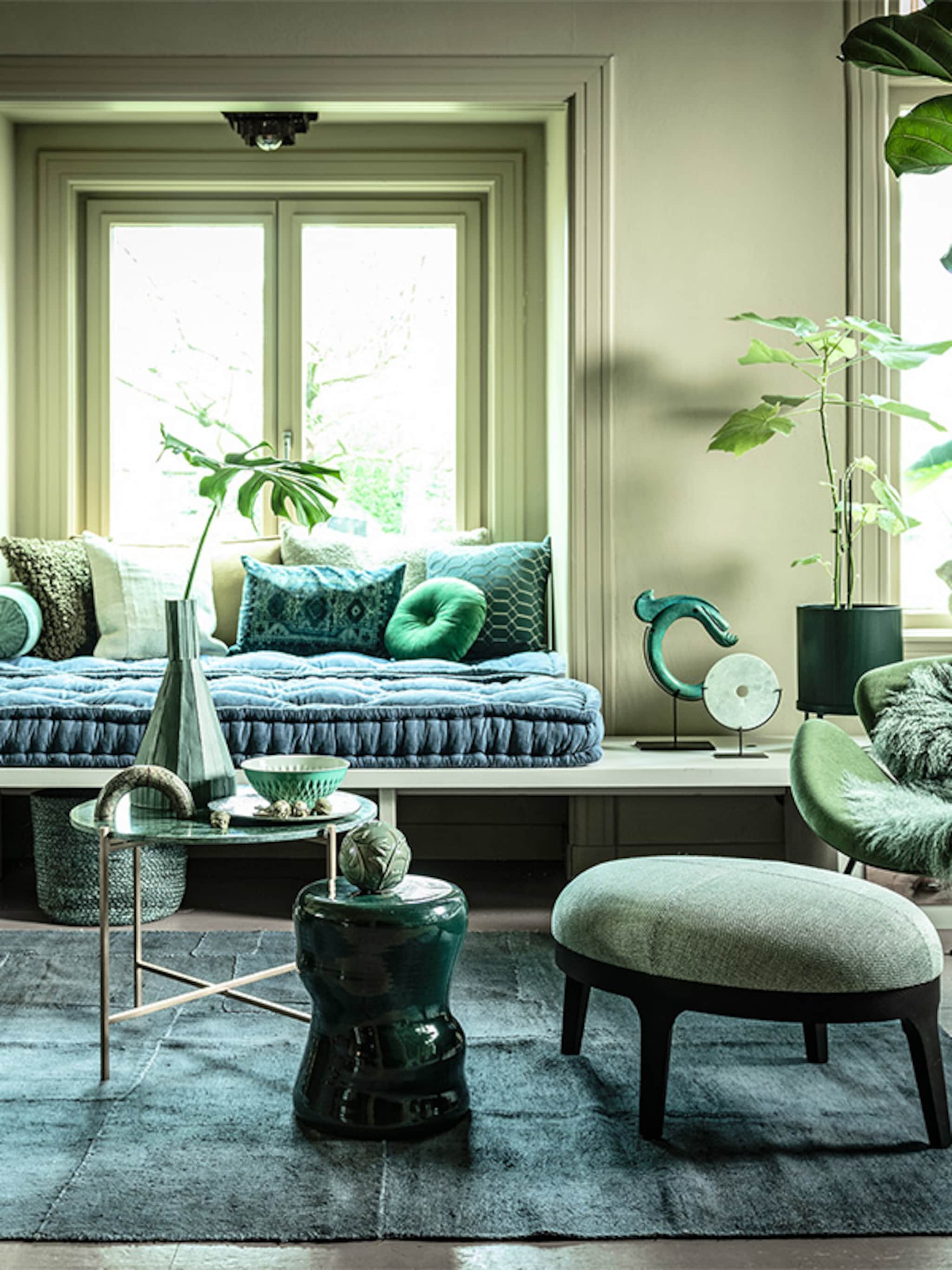 geen genoeg van groen haal de natuur in huis met een groene woonkamer