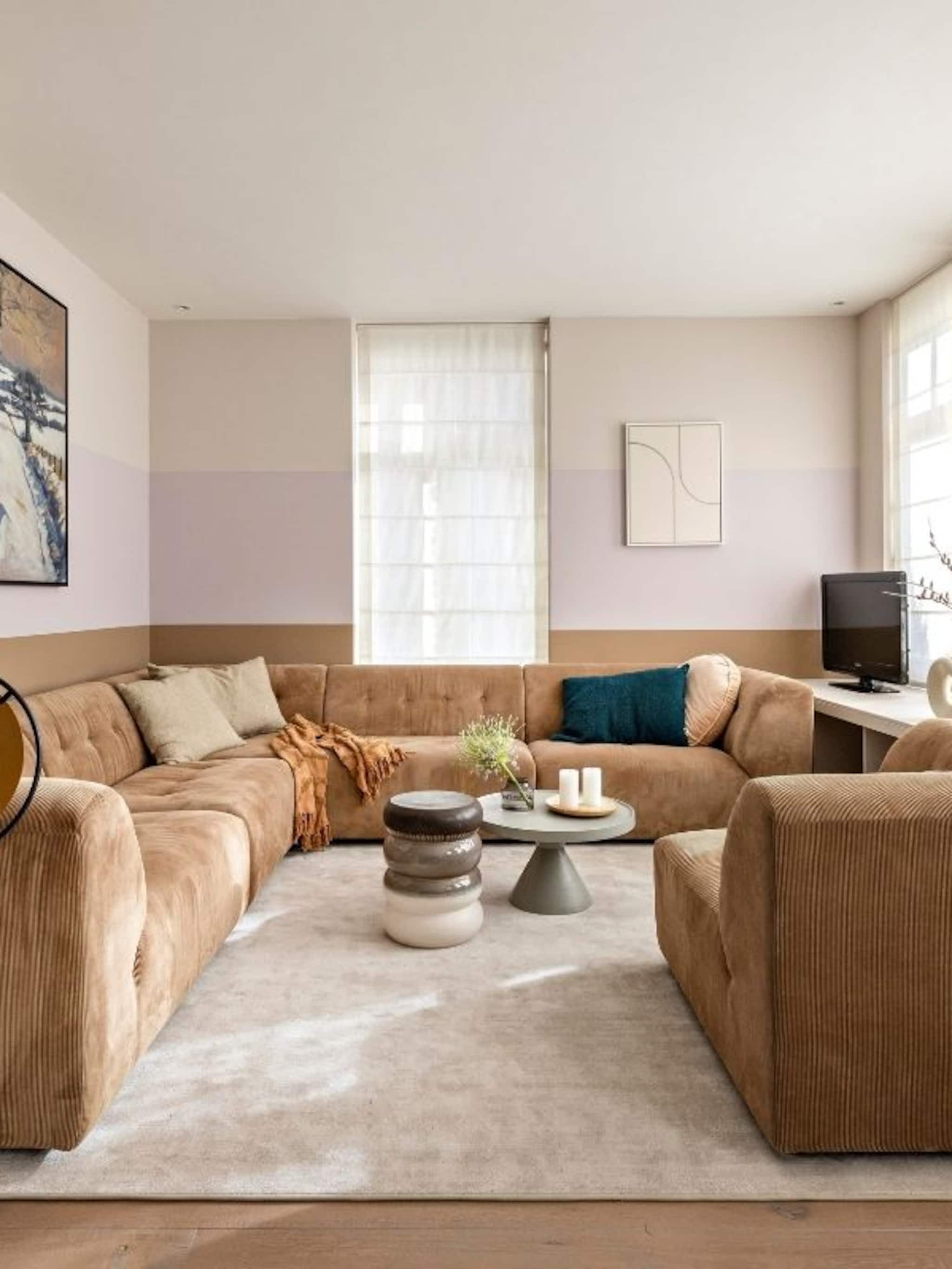 zo richt je een l vormige woonkamer het best in