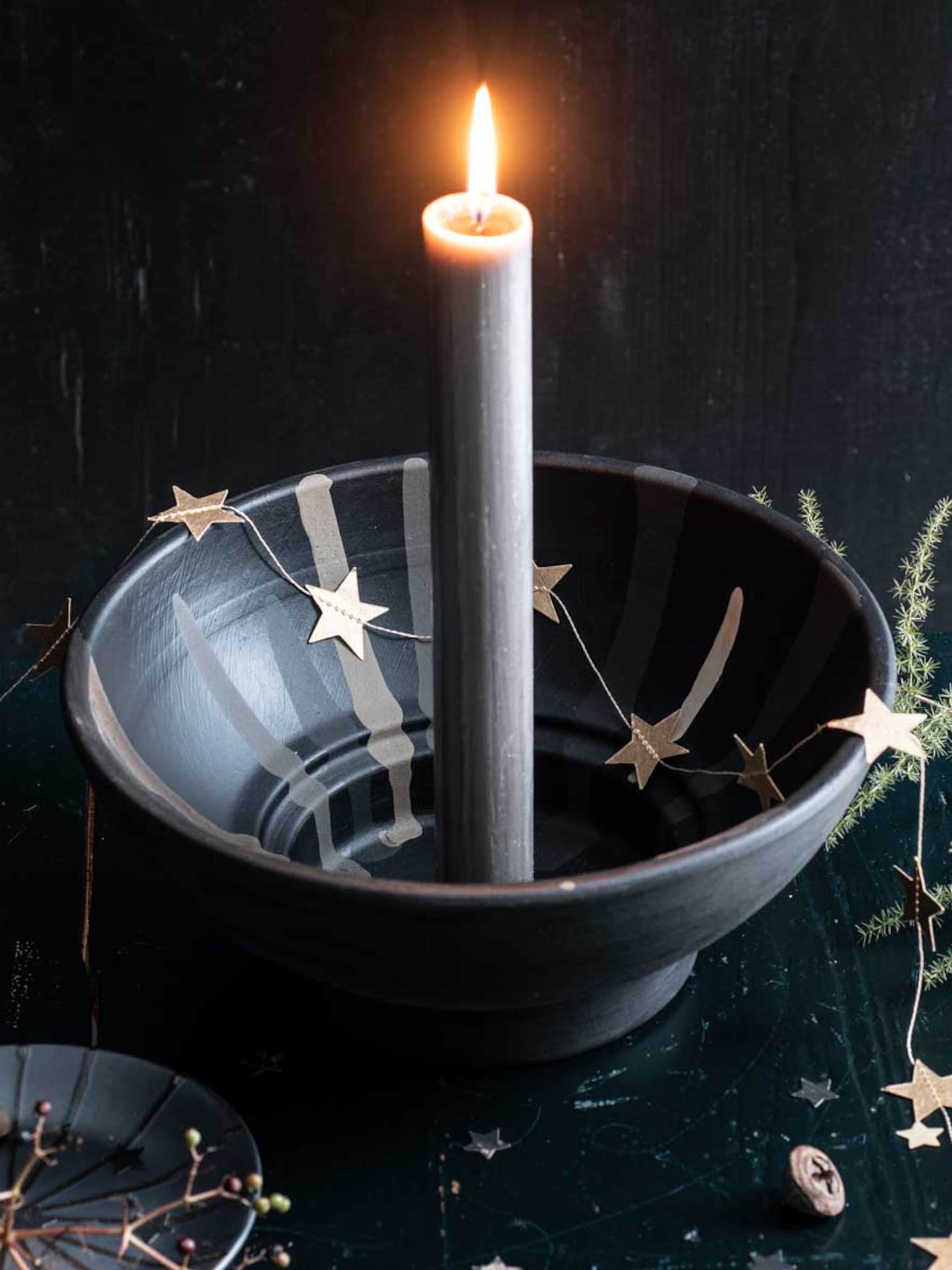 diy tover een oude bloempot om tot kandelaar
