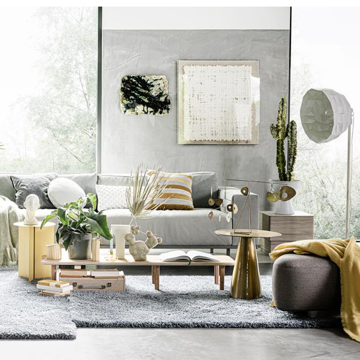 grijze bank met bijzettafels en groot vloerkleed Bright Bubble trend | vtwonen stylist Liza |